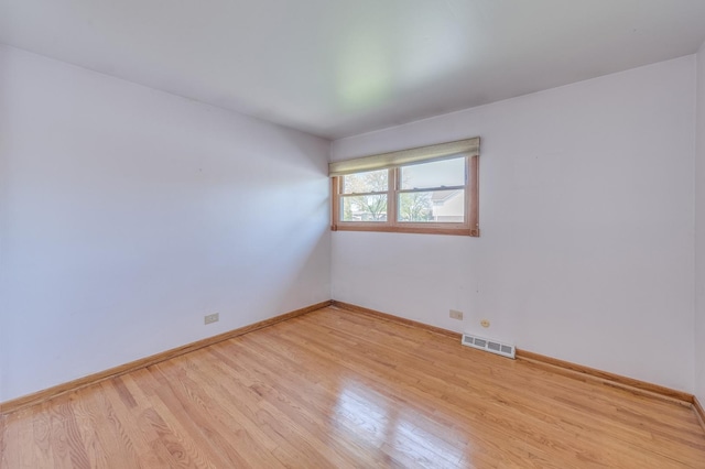 1825 W Sherry Ln, Addison, IL 60101 - empty room featuring light wood finished floors and baseboards