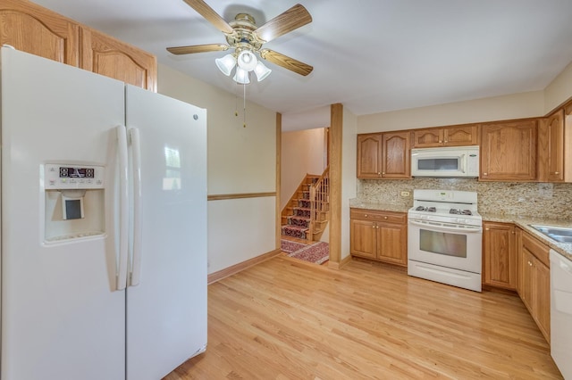 1825 W Sherry Ln, Addison, IL 60101 - kitchen with white appliances, light wood-type flooring, light countertops, and backsplash