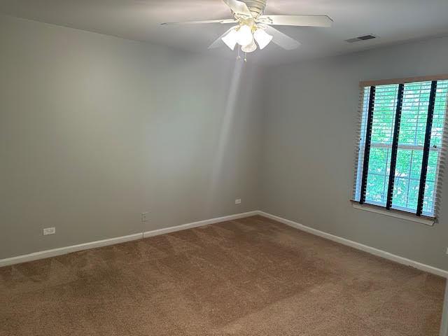1127 Orleans Dr, Mundelein, IL 60060 - carpeted empty room with ceiling fan and baseboards