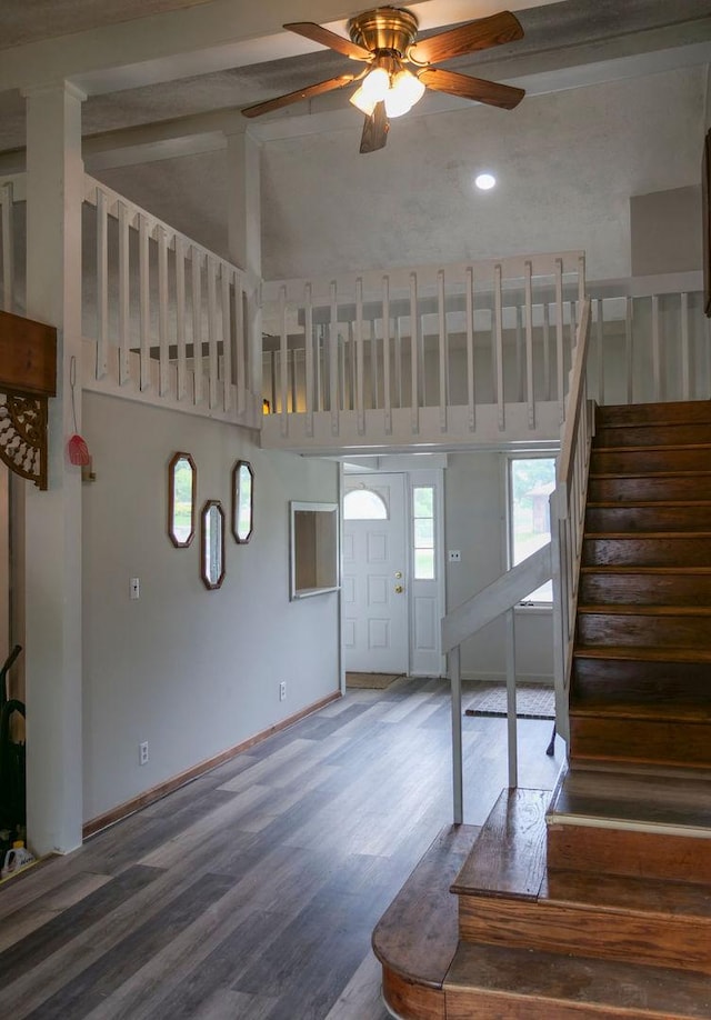 510 W Harrison St, Villa Grove, IL 61956 - foyer with high vaulted ceiling, stairway, ceiling fan, plenty of natural light, and wood finished floors