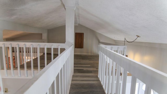 510 W Harrison St, Villa Grove, IL 61956 - staircase with wood finished floors, vaulted ceiling, and a textured ceiling