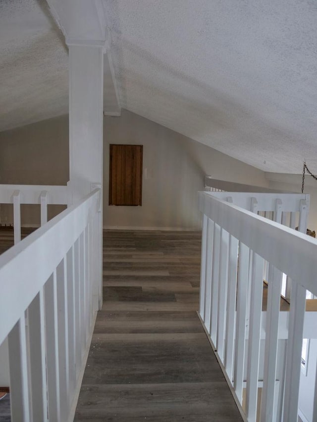 510 W Harrison St, Villa Grove, IL 61956 - additional living space featuring a textured ceiling, wood finished floors, and vaulted ceiling