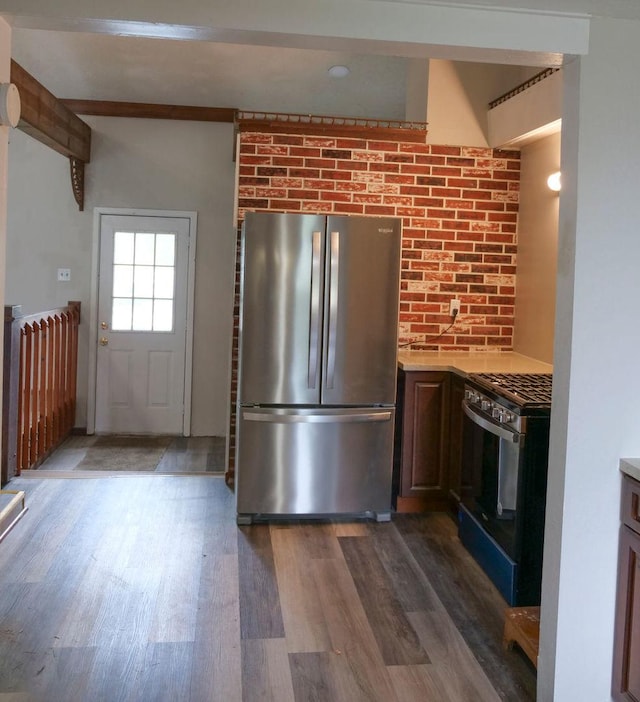 510 W Harrison St, Villa Grove, IL 61956 - kitchen featuring stainless steel appliances, dark wood-style floors, and light countertops