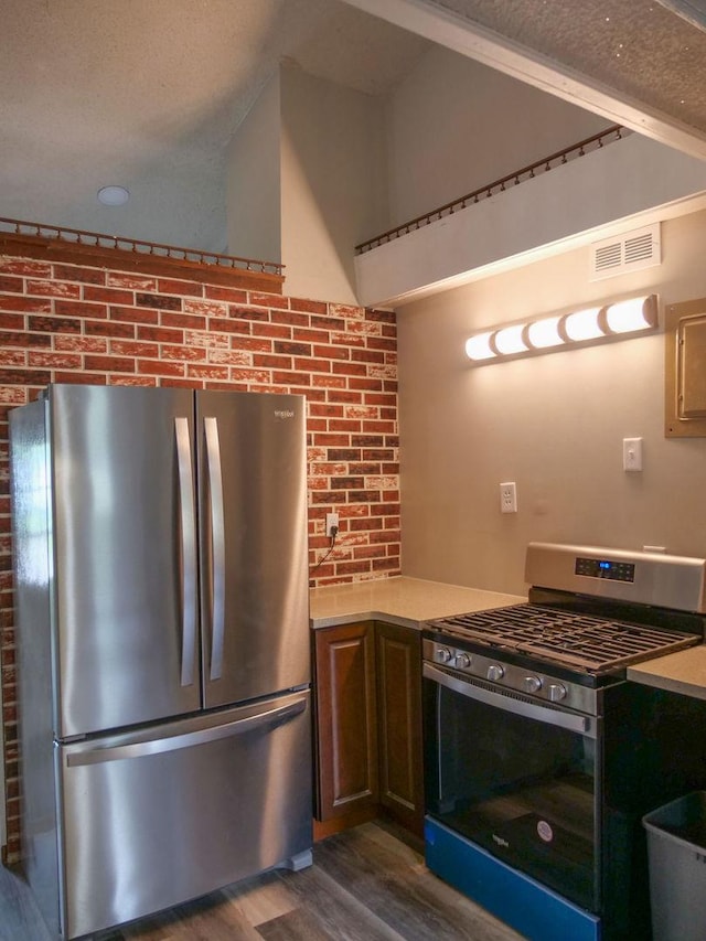 510 W Harrison St, Villa Grove, IL 61956 - kitchen with stainless steel appliances, dark wood-style flooring, and light countertops