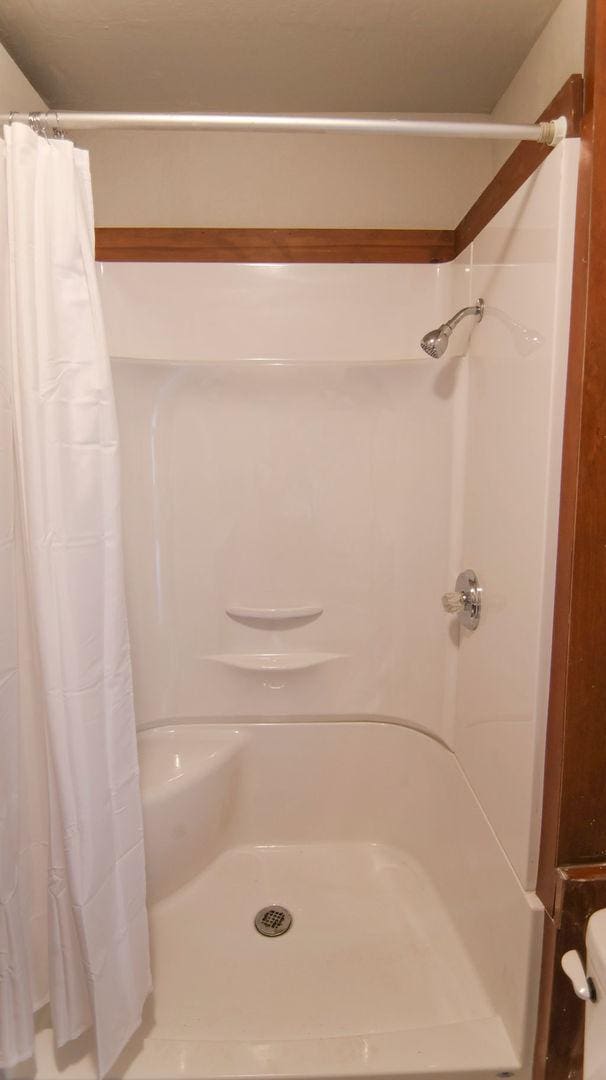 510 W Harrison St, Villa Grove, IL 61956 - full bathroom with a shower with shower curtain
