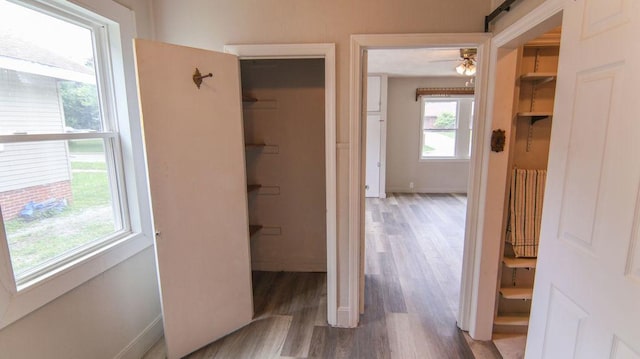 510 W Harrison St, Villa Grove, IL 61956 - hall with wood finished floors, radiator heating unit, and baseboards
