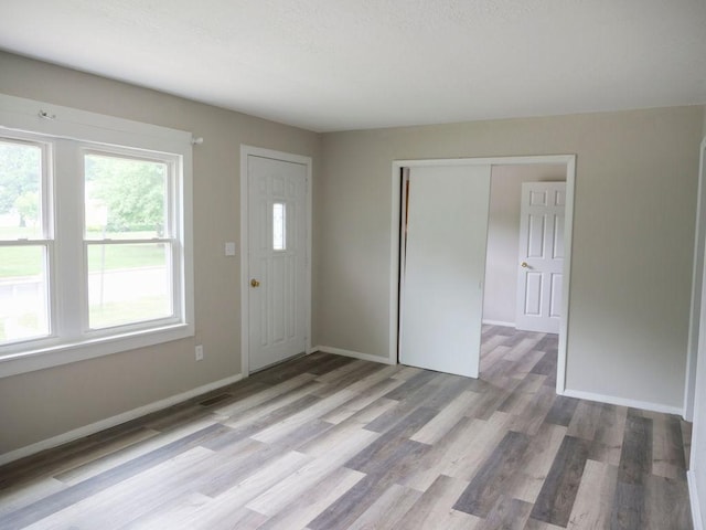 510 W Harrison St, Villa Grove, IL 61956 - foyer featuring light wood-style floors and baseboards