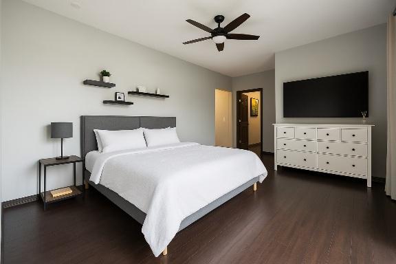 bedroom featuring dark wood finished floors and a ceiling fan
