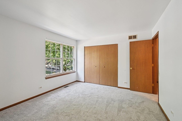 189 Port Royal Cir, Aurora, IL 60504 - unfurnished bedroom with a closet and carpet flooring