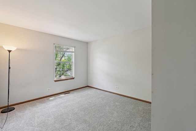 189 Port Royal Cir, Aurora, IL 60504 - carpeted empty room with baseboards