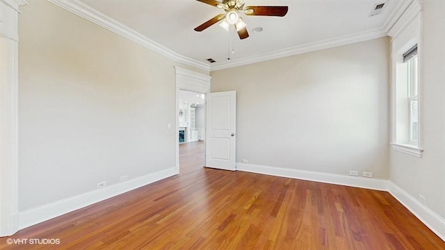 2540 W Diversey Ave Unit 404, Chicago, IL 60647 - unfurnished room with a ceiling fan, ornamental molding, wood finished floors, and baseboards