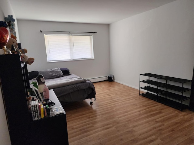 659 E Fullerton Ave Unit 201, Glendale Heights, IL 60139 - bedroom featuring wood finished floors and baseboard heating