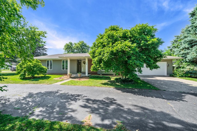 28 Lions Rd, Sandwich, IL 60548 - view of front of home with driveway, a front lawn, and an attached garage