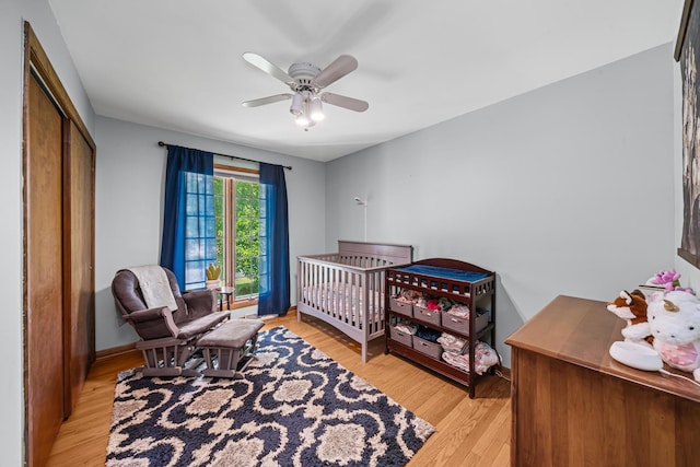 28 Lions Rd, Sandwich, IL 60548 - bedroom with light wood-type flooring, a closet, and a ceiling fan