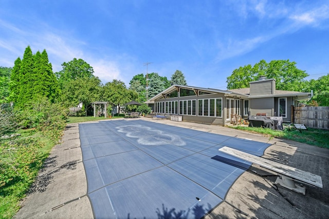 28 Lions Rd, Sandwich, IL 60548 - view of swimming pool featuring a sunroom and a patio