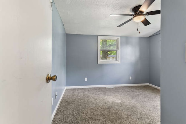 1003 S Pleasantview Dr, Tuscola, IL 61953 - unfurnished room with a ceiling fan, a textured ceiling, baseboards, and carpet floors