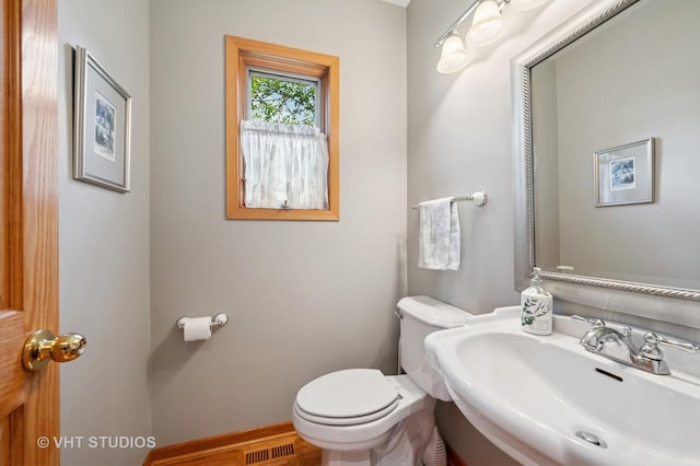 9008 Marmora Ave, Morton Grove, IL 60053 - half bathroom with a sink and toilet