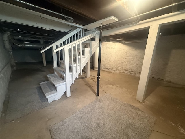557 W Water St, Waukegan, IL 60085 - unfinished below grade area featuring stairway