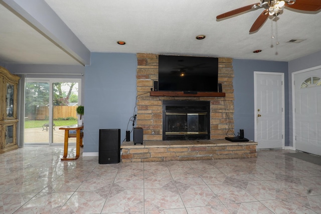 19421 W Hoag Ct, Mundelein, IL 60060 - living room with a stone fireplace, ceiling fan, baseboards, and marble finish flooring