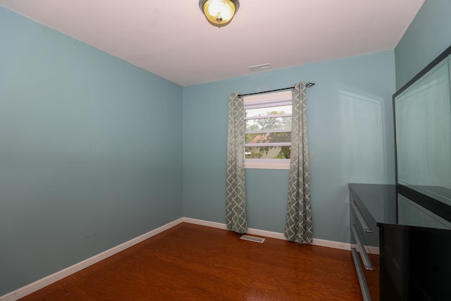 19421 W Hoag Ct, Mundelein, IL 60060 - spare room featuring dark wood-style floors and baseboards