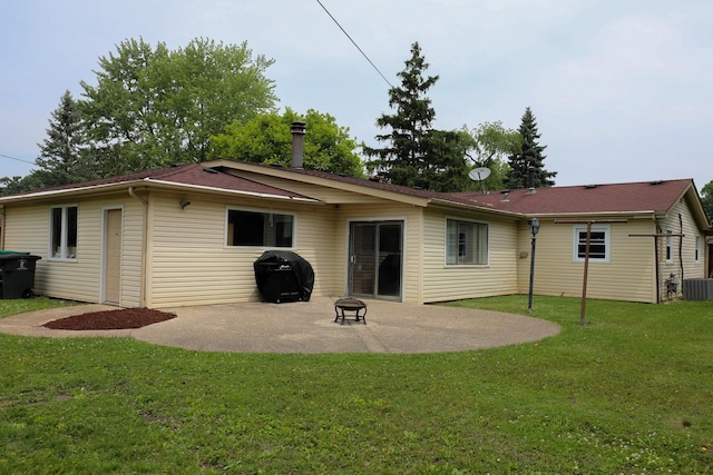 19421 W Hoag Ct, Mundelein, IL 60060 - rear view of house with a patio area, a lawn, an outdoor fire pit, and central AC unit
