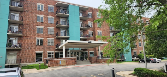 9355 Irving Park Rd Unit 208, Schiller Park, IL 60176 - view of apartment building / complex with uncovered parking