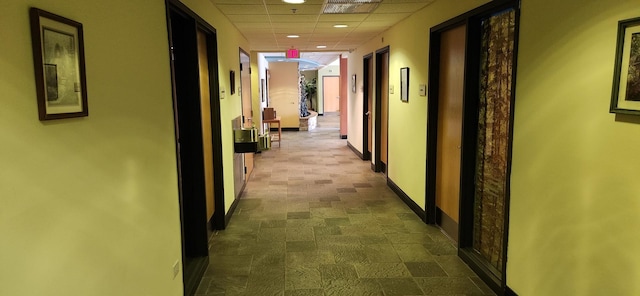 9355 Irving Park Rd Unit 208, Schiller Park, IL 60176 - hallway featuring recessed lighting, a paneled ceiling, and baseboards