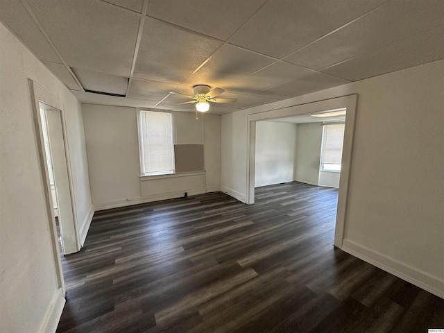 818-20 S 8th St, Quincy, IL 62301 - unfurnished room with dark wood-type flooring, a ceiling fan, baseboards, and a drop ceiling