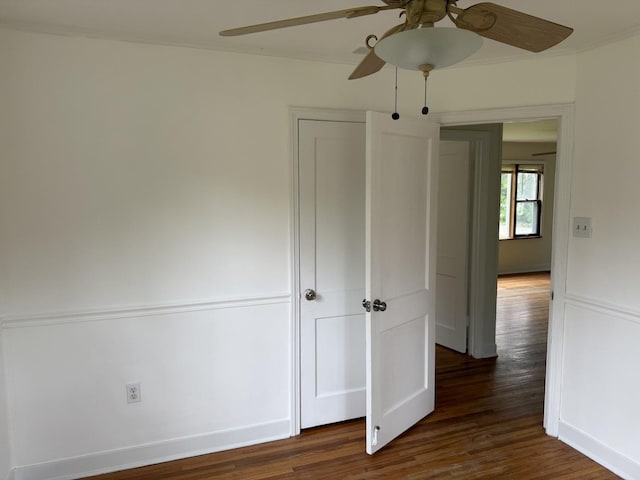 1310 S Sumner St, Wheaton, IL 60187 - empty room with a ceiling fan, wood finished floors, baseboards, and crown molding