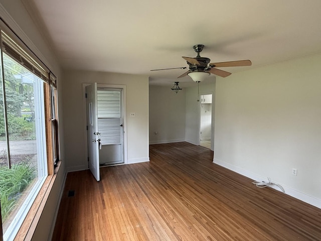 1310 S Sumner St, Wheaton, IL 60187 - spare room featuring ceiling fan, baseboards, and wood finished floors