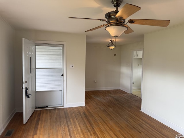 1310 S Sumner St, Wheaton, IL 60187 - unfurnished room with wood finished floors, baseboards, and ceiling fan