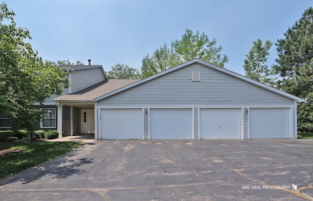 620 Mallard Ct Unit C1, Bartlett, IL 60103 - view of front of home featuring asphalt driveway, a garage, and a shingled roof