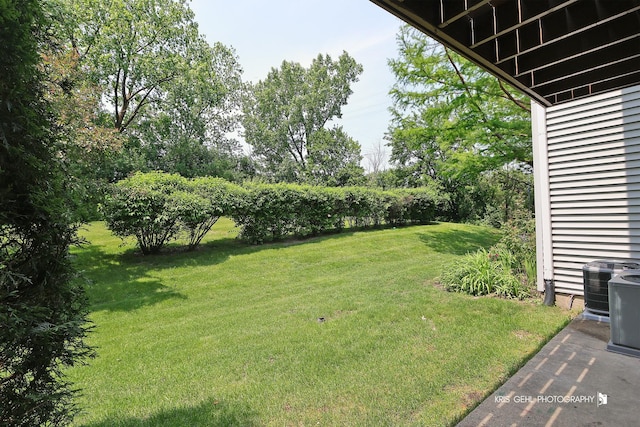 620 Mallard Ct Unit C1, Bartlett, IL 60103 - view of green lawn featuring cooling unit