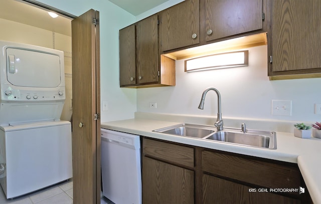 620 Mallard Ct Unit C1, Bartlett, IL 60103 - kitchen with white dishwasher, estacked washer and dryer, a sink, and light countertops