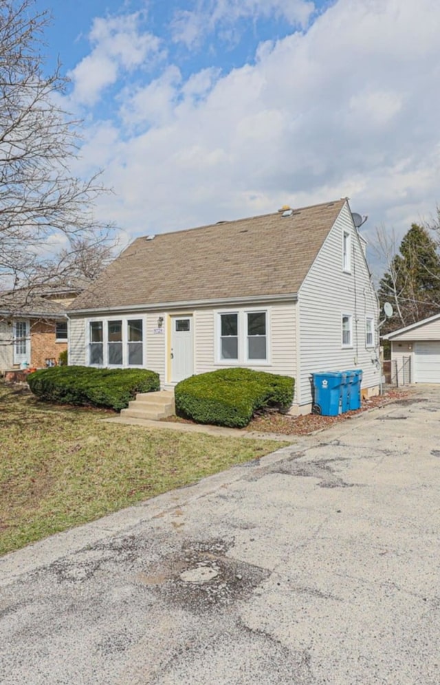 9729 S 81st Ave, Palos Hills, IL 60465 - view of front of property featuring an outbuilding, a garage, and a shingled roof
