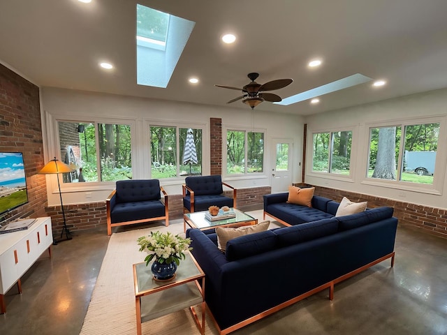 26136 E 2200 N Rd, Lexington, IL 61753 - living area with concrete flooring, a skylight, brick wall, plenty of natural light, and recessed lighting