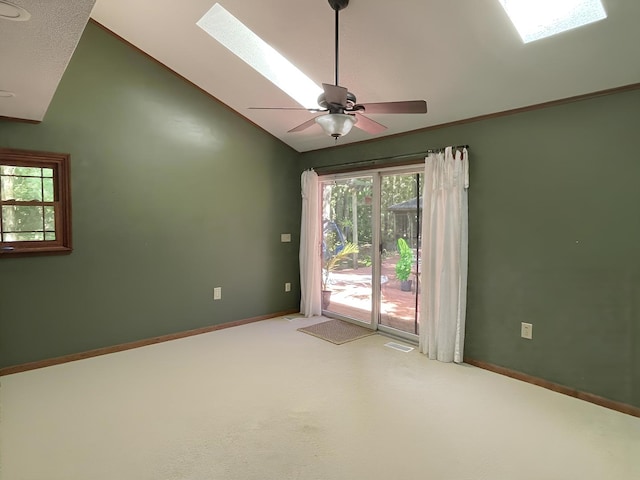 26136 E 2200 N Rd, Lexington, IL 61753 - unfurnished room featuring vaulted ceiling, a skylight, carpet floors, and a ceiling fan