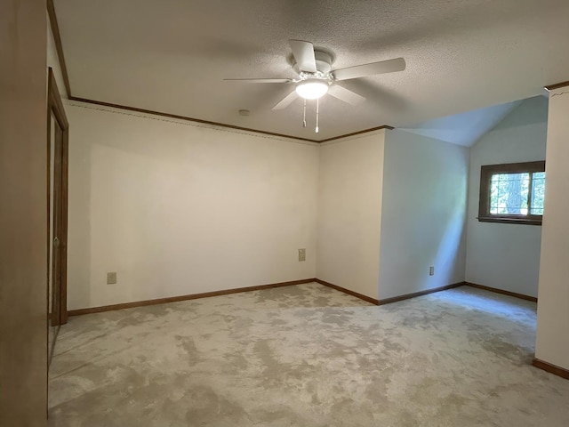 26136 E 2200 N Rd, Lexington, IL 61753 - empty room with light colored carpet, ceiling fan, a textured ceiling, and vaulted ceiling