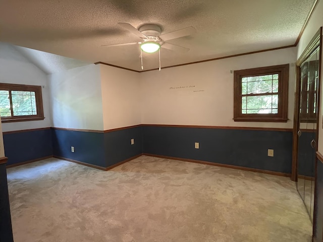 26136 E 2200 N Rd, Lexington, IL 61753 - spare room with light carpet, a textured ceiling, a ceiling fan, and crown molding