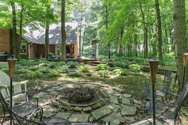 26136 E 2200 N Rd, Lexington, IL 61753 - view of yard with a fire pit, a wooden deck, and a patio