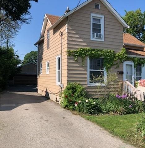 1416 Hamilton Ct, Waukegan, IL 60085 - view of side of home featuring an outdoor structure and cooling unit