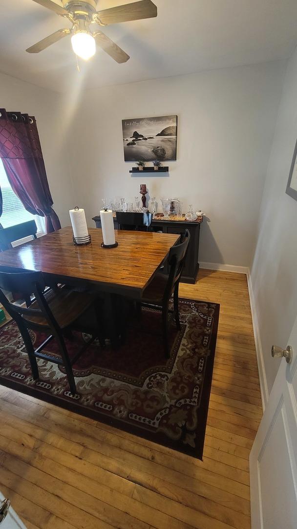 2676 N Julian Ter, River Grove, IL 60171 - dining room with light wood-style flooring, ceiling fan, and baseboards