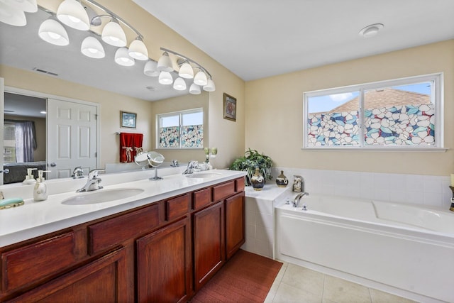 2023 Torino Dr, Elgin, IL 60123 - bathroom with double vanity, a bath, and tile patterned flooring