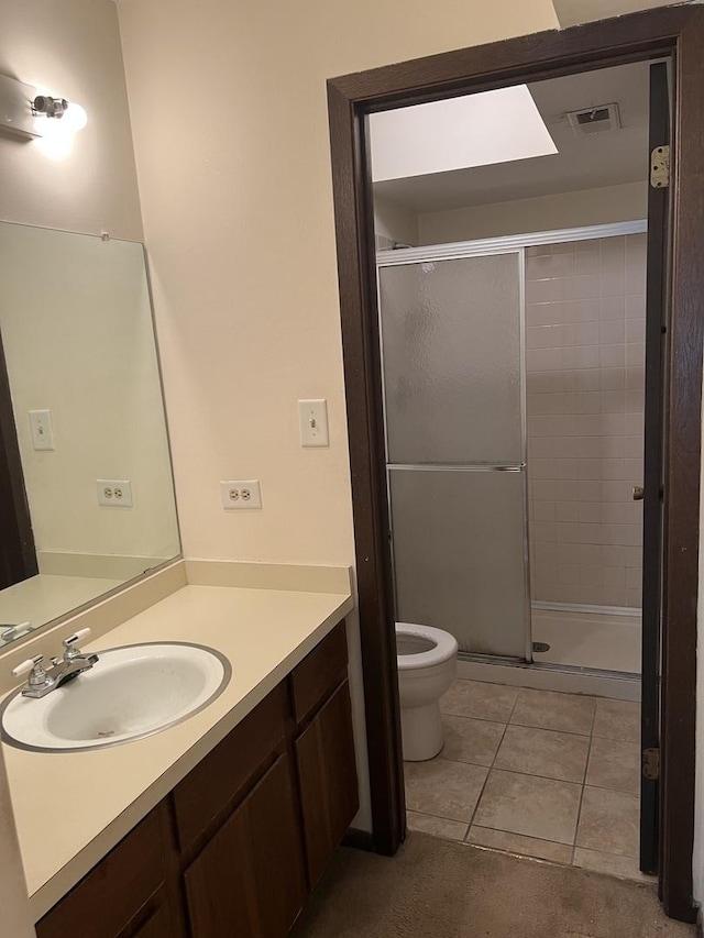 18040 Royal Oak Ct Unit 2, Tinley Park, IL 60477 - bathroom featuring toilet, vanity, a stall shower, and tile patterned flooring