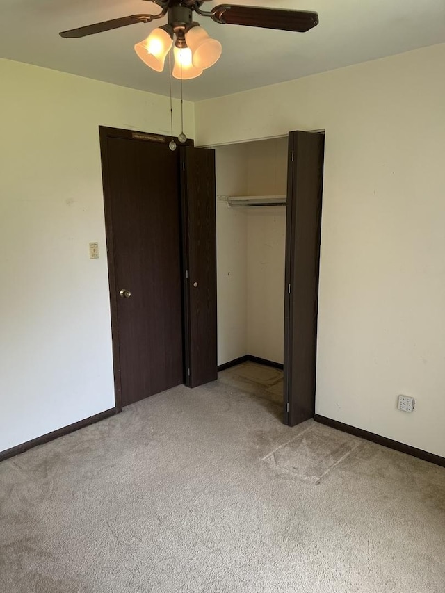 18040 Royal Oak Ct Unit 2, Tinley Park, IL 60477 - unfurnished bedroom featuring light colored carpet, a closet, baseboards, and a ceiling fan