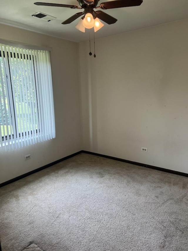 18040 Royal Oak Ct Unit 2, Tinley Park, IL 60477 - carpeted spare room with baseboards and a ceiling fan