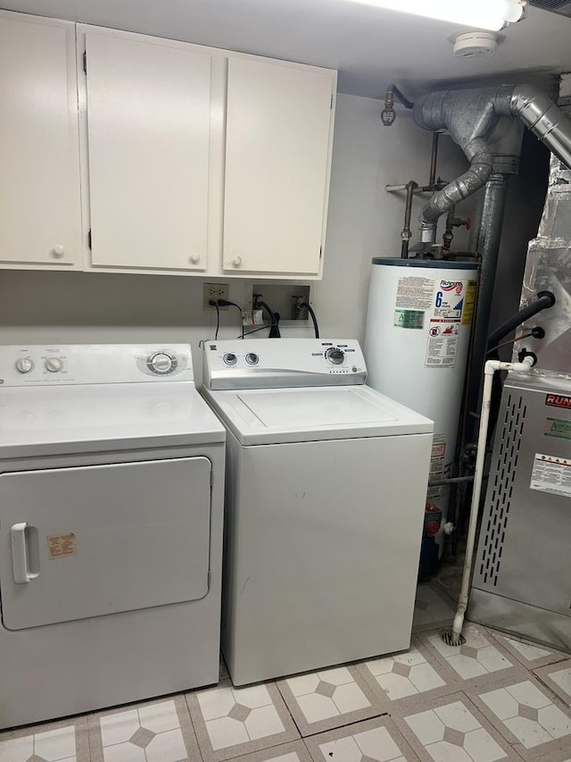 18040 Royal Oak Ct Unit 2, Tinley Park, IL 60477 - laundry area with cabinet space, washer and clothes dryer, gas water heater, and light flooring