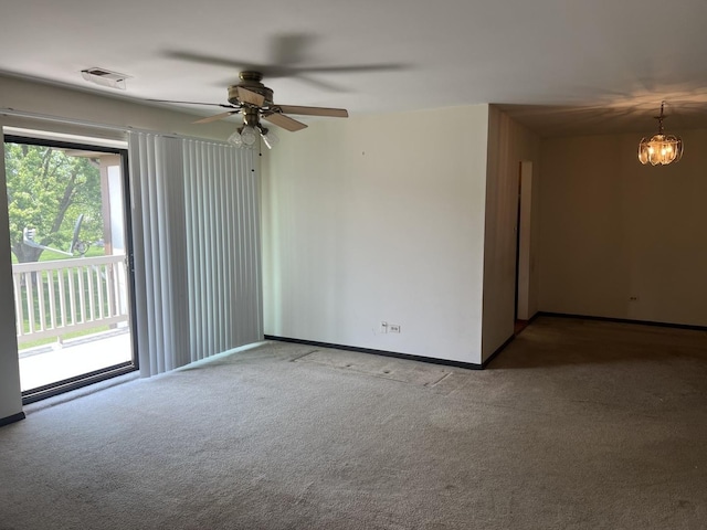 18040 Royal Oak Ct Unit 2, Tinley Park, IL 60477 - carpeted spare room featuring a ceiling fan, baseboards, and a chandelier
