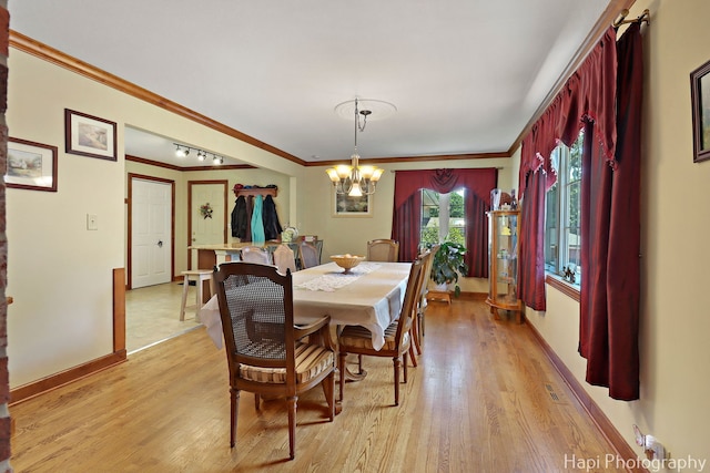 1415 Arabian Spur, Mchenry, IL 60051 - dining space with a chandelier, ornamental molding, and light wood-type flooring