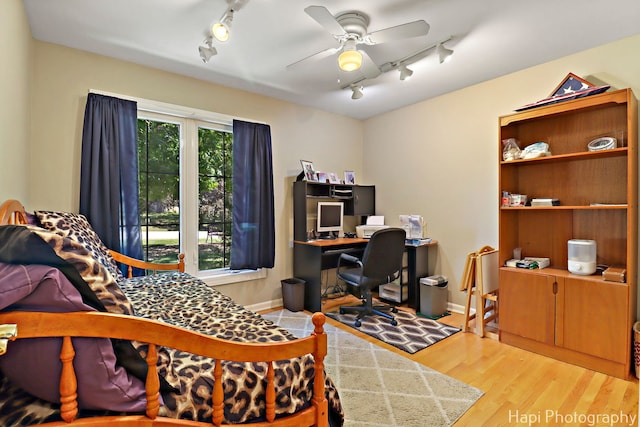 1415 Arabian Spur, Mchenry, IL 60051 - bedroom featuring rail lighting, an office area, and wood finished floors